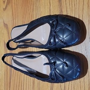 Women size twelve ballet slippers with elastic in the back